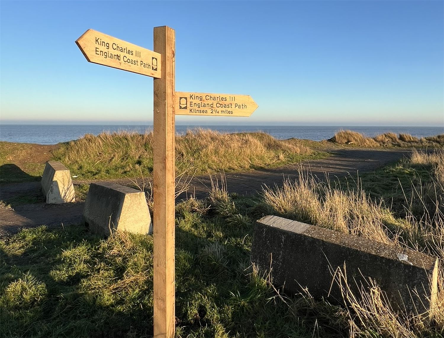 King Charles Coast Path wooden sign post 