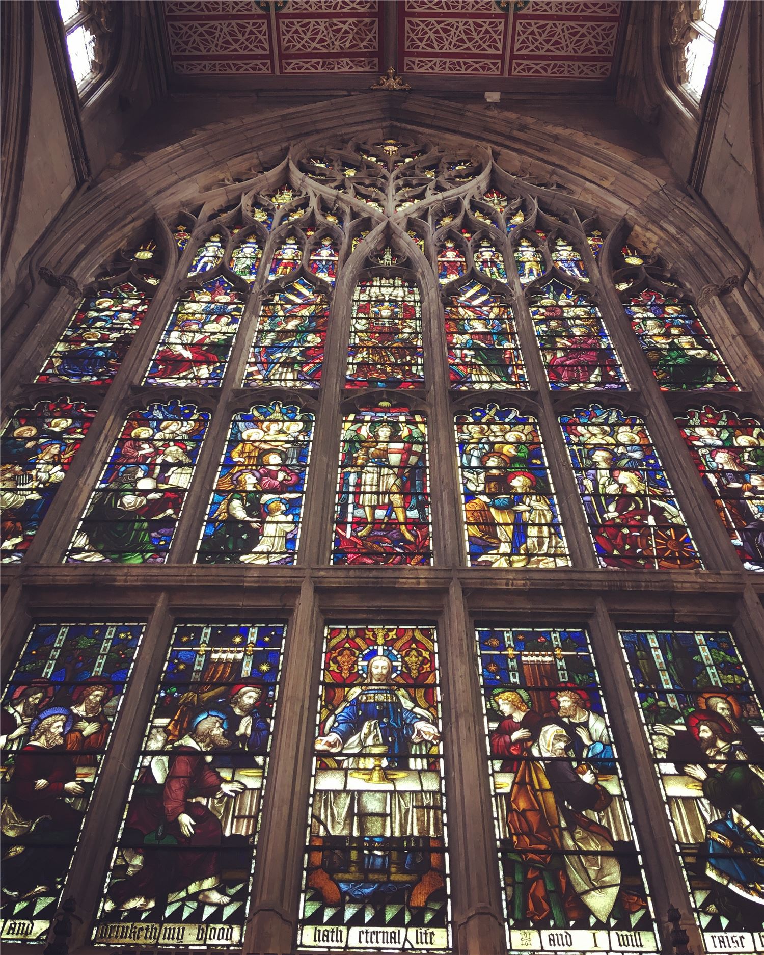 Image of the main stained glass window in Hull Minster and the decorative ceiling
